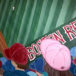 Red Sox fan with a pink baseball  hat